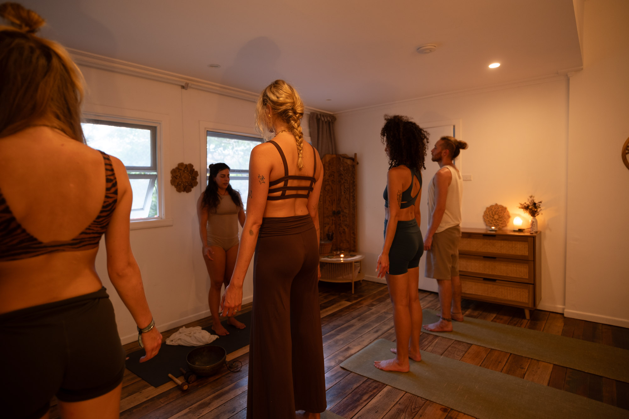 Five students standing together in practice at the INNER HOME studio